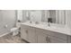 Bathroom featuring a double vanity, modern fixtures, and neutral color scheme at 13013 Oak Hill Way, Parrish, FL 34219