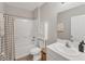 Bathroom with shower/tub combo, single sink vanity, and neutral color scheme at 13013 Oak Hill Way, Parrish, FL 34219