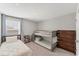 Neutral bedroom with bunkbeds and dresser with carpeted floor and natural light at 13013 Oak Hill Way, Parrish, FL 34219