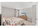 Bright bedroom with two twin beds, dresser and TV; carpeted floors and neutral color scheme at 13013 Oak Hill Way, Parrish, FL 34219