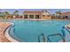 Beautiful zero entry community pool featuring a sun shelf and community clubhouse at 13013 Oak Hill Way, Parrish, FL 34219