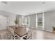 Bright dining room with plenty of natural light, wood-look floors, and neutral decor at 13013 Oak Hill Way, Parrish, FL 34219