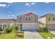 Charming two-story home with a well-manicured lawn, landscaping, and inviting curb appeal at 13013 Oak Hill Way, Parrish, FL 34219