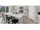 Contemporary kitchen featuring a center island with bar seating and modern stainless steel appliances at 13013 Oak Hill Way, Parrish, FL 34219