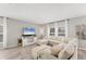 Inviting living room showcasing a comfortable sectional sofa, large windows, and stylish decor at 13013 Oak Hill Way, Parrish, FL 34219