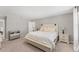 Serene main bedroom features a bed, neutral color scheme, and plenty of natural light at 13013 Oak Hill Way, Parrish, FL 34219