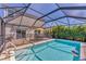 A private screened-in pool is located in the backyard and features outdoor seating at 13013 Oak Hill Way, Parrish, FL 34219