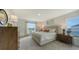 Serene main bedroom with a large window, neutral tones, and stylish decor at 13108 Bayberry Way, Parrish, FL 34219
