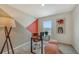 Stylish home office offers a modern desk, comfortable seating, and ample natural light for productivity at 13124 Bayberry Way, Parrish, FL 34219