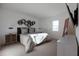 Modern bedroom with a bed, stylish decor, and ample natural light at 13128 Bayberry Way, Parrish, FL 34219