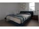 Relaxing bedroom featuring a comfortable bed, neutral tones, and modern lamps at 13128 Bayberry Way, Parrish, FL 34219