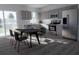 Modern kitchen featuring stainless steel appliances, spacious cabinets, and a dining table at 13128 Bayberry Way, Parrish, FL 34219
