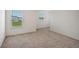 Bright bedroom with neutral carpet, with windows bringing in natural light at 13132 Bayberry Way, Parrish, FL 34219