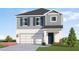 New construction home featuring a two-car garage and a well-maintained lawn at 13132 Bayberry Way, Parrish, FL 34219