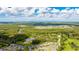 The neighborhood from above, surrounded by green spaces, ponds, and trees, suggesting a peaceful and connected community at 14921 Barrows Bluff Ter, Bradenton, FL 34212