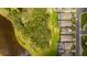 Birds eye view of the property highlighting its proximity to the pond and street at 14921 Barrows Bluff Ter, Bradenton, FL 34212