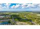 Stunning aerial view of the neighborhood, lakes, and lush greenery at 14921 Barrows Bluff Ter, Bradenton, FL 34212