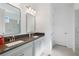 Bright bathroom with double vanity, stylish mirrors, and modern fixtures at 14921 Barrows Bluff Ter, Bradenton, FL 34212