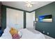 Comfortable bedroom features a ceiling fan, TV, and neutral-toned walls at 14921 Barrows Bluff Ter, Bradenton, FL 34212