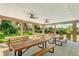 Open-air community pavilion featuring picnic tables, ceiling fans, and views of the scenic natural surroundings at 14921 Barrows Bluff Ter, Bradenton, FL 34212