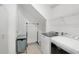 Bright laundry room with modern appliances and ample storage space at 14921 Barrows Bluff Ter, Bradenton, FL 34212