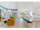 Bright, open living space flowing into the kitchen with an island, perfect for entertaining and modern living at 14921 Barrows Bluff Ter, Bradenton, FL 34212