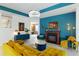The living room highlights a fireplace, modern lighting, and stylish decor, with a seamless flow to other rooms at 14921 Barrows Bluff Ter, Bradenton, FL 34212