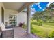 Relaxing outdoor patio with comfortable seating and serene views of the lush green lawn at 14921 Barrows Bluff Ter, Bradenton, FL 34212