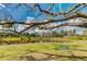 Scenic pond surrounded by lush landscaping, featuring a charming tree swing for outdoor fun at 14921 Barrows Bluff Ter, Bradenton, FL 34212