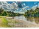Picturesque river view with lush greenery and sandy shoreline, offering a tranquil and scenic landscape at 14921 Barrows Bluff Ter, Bradenton, FL 34212