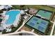Aerial view of community amenities including a pool, pickleball, tennis, and basketball courts at 16905 Sweetwater Village Dr, Bradenton, FL 34211