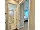 Hallway leading to bathroom and bedroom, offers a glimpse into the home's layout at 16905 Sweetwater Village Dr, Bradenton, FL 34211