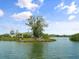 Waterfront community with lush trees and bay views from an elevated perspective at 1703 Pelican Cove Rd # 356, Sarasota, FL 34231
