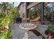 Backyard patio with grill, bird bath, and two chairs at 1703 Pelican Cove Rd # 356, Sarasota, FL 34231