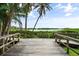 Picturesque boardwalk with lush greenery and glimpses of the waterfront at 1703 Pelican Cove Rd # 356, Sarasota, FL 34231