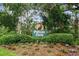 Welcoming Pelican Cove community entrance featuring lush landscaping and a charming Pelican Cove sign at 1703 Pelican Cove Rd # 356, Sarasota, FL 34231