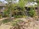 Two-story tan home with stairs to second level and screened in patio at 1703 Pelican Cove Rd # 356, Sarasota, FL 34231