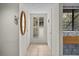 Hallway with tile flooring, closet and a decorative mirror at 1703 Pelican Cove Rd # 356, Sarasota, FL 34231