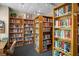 Well stocked library with multiple shelves and organized layout at 1703 Pelican Cove Rd # 356, Sarasota, FL 34231