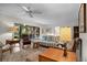 Cozy living room with comfortable seating, natural light, and view of the patio at 1703 Pelican Cove Rd # 356, Sarasota, FL 34231