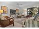 Inviting living room with stylish decor, natural light, and comfortable seating arrangement at 1703 Pelican Cove Rd # 356, Sarasota, FL 34231