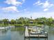 Waterfront condo community with marina, docks and boats with beautiful blue skies at 1703 Pelican Cove Rd # 356, Sarasota, FL 34231