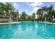 Inviting community pool with plenty of seating for residents at 1703 Pelican Cove Rd # 356, Sarasota, FL 34231