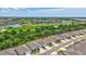 An aerial shot of a neighborhood near a golf course showing well-maintained lawns and beautiful landscaping at 17032 Harvest Moon Way, Bradenton, FL 34211