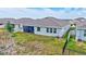 Home's backyard features a screened-in lanai, and minimal landscaping at 17032 Harvest Moon Way, Bradenton, FL 34211