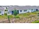 The back of the home with a screened-in porch and a fenced backyard at 17032 Harvest Moon Way, Bradenton, FL 34211