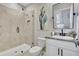 Modern bathroom featuring a tiled shower with glass door, a toilet and vanity with elegant fixtures at 17032 Harvest Moon Way, Bradenton, FL 34211