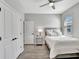 Simple bedroom with wood floor and a ceiling fan at 17032 Harvest Moon Way, Bradenton, FL 34211