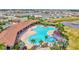 Community pool with many lounge chairs and shaded seating areas at 17032 Harvest Moon Way, Bradenton, FL 34211