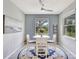 Cozy breakfast nook featuring a round table, comfortable seating, and natural light at 17032 Harvest Moon Way, Bradenton, FL 34211